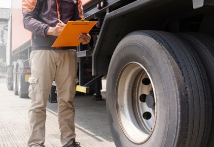 Man evaluating truck tires
