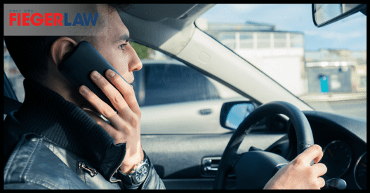 man on cellphone while driving