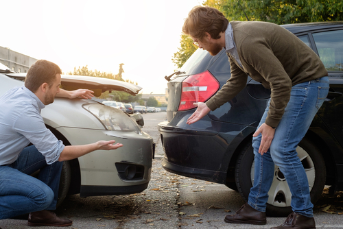 men talking after a car accident