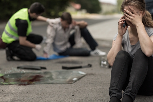 Woman On Her Cell After A Car Accident 