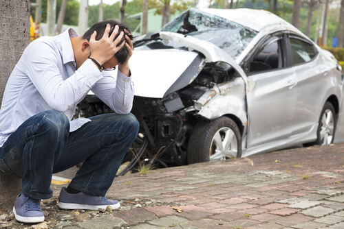 kneeling by car