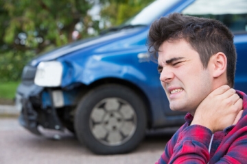 Man with Hurt Neck After Car Accident