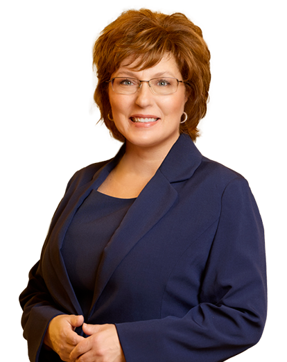 a woman wearing glasses and a blue suit