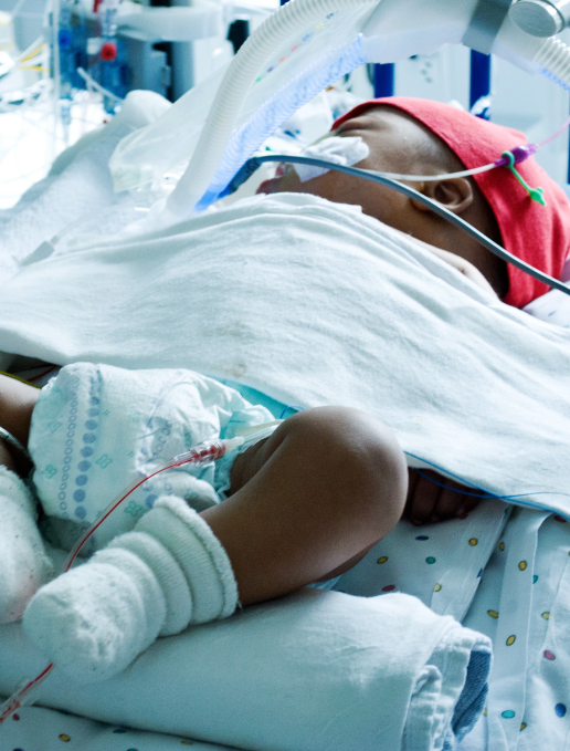 GettyImages-1169750609 1 a baby in a hospital bed