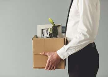 employee holding personal items