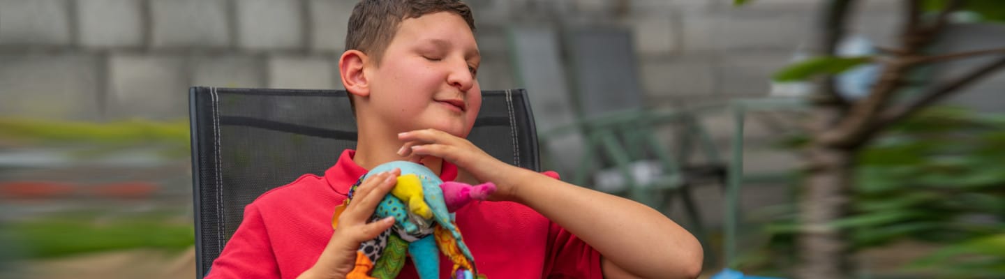 image of child holding toy