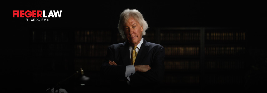a man in a suit with his arms crossed