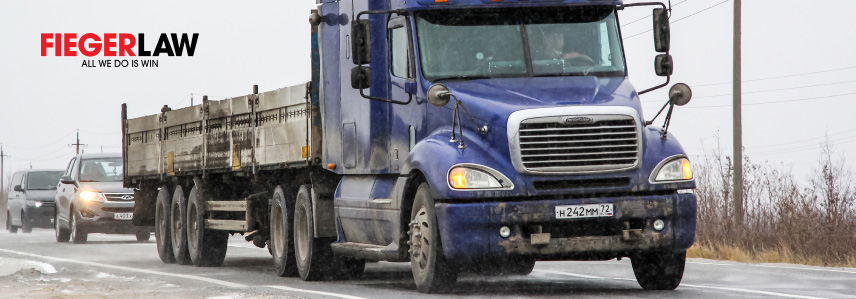a blue truck on the road