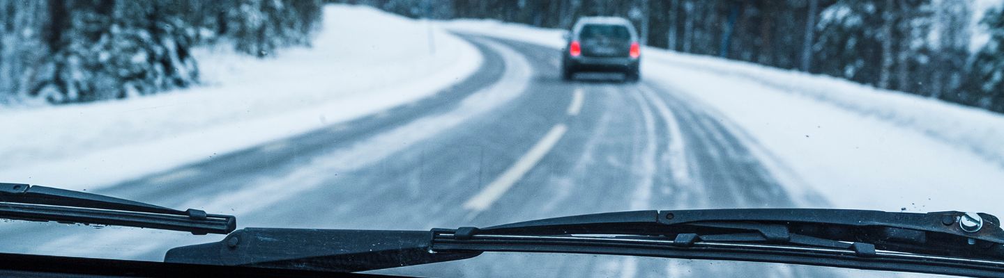 a car driving on a snowy road